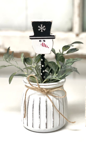 Seasonal floral arrangement, white rustic vase