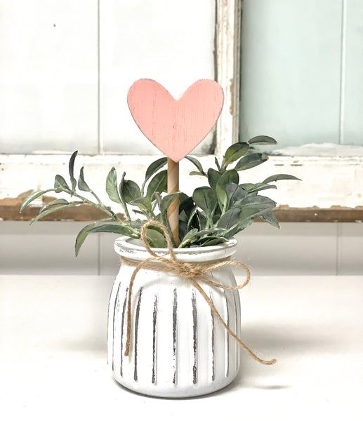 Seasonal floral arrangement, white rustic vase
