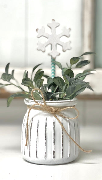 Seasonal floral arrangement, white rustic vase