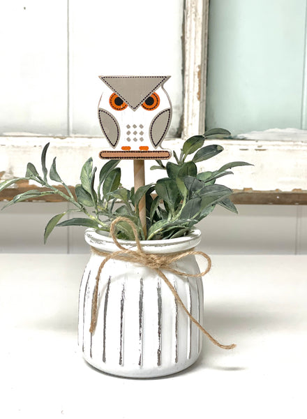 Seasonal floral arrangement, white rustic vase