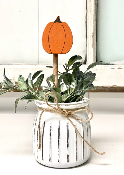 Seasonal floral arrangement, white rustic vase