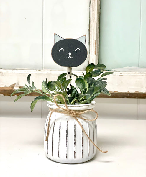 Seasonal floral arrangement, white rustic vase