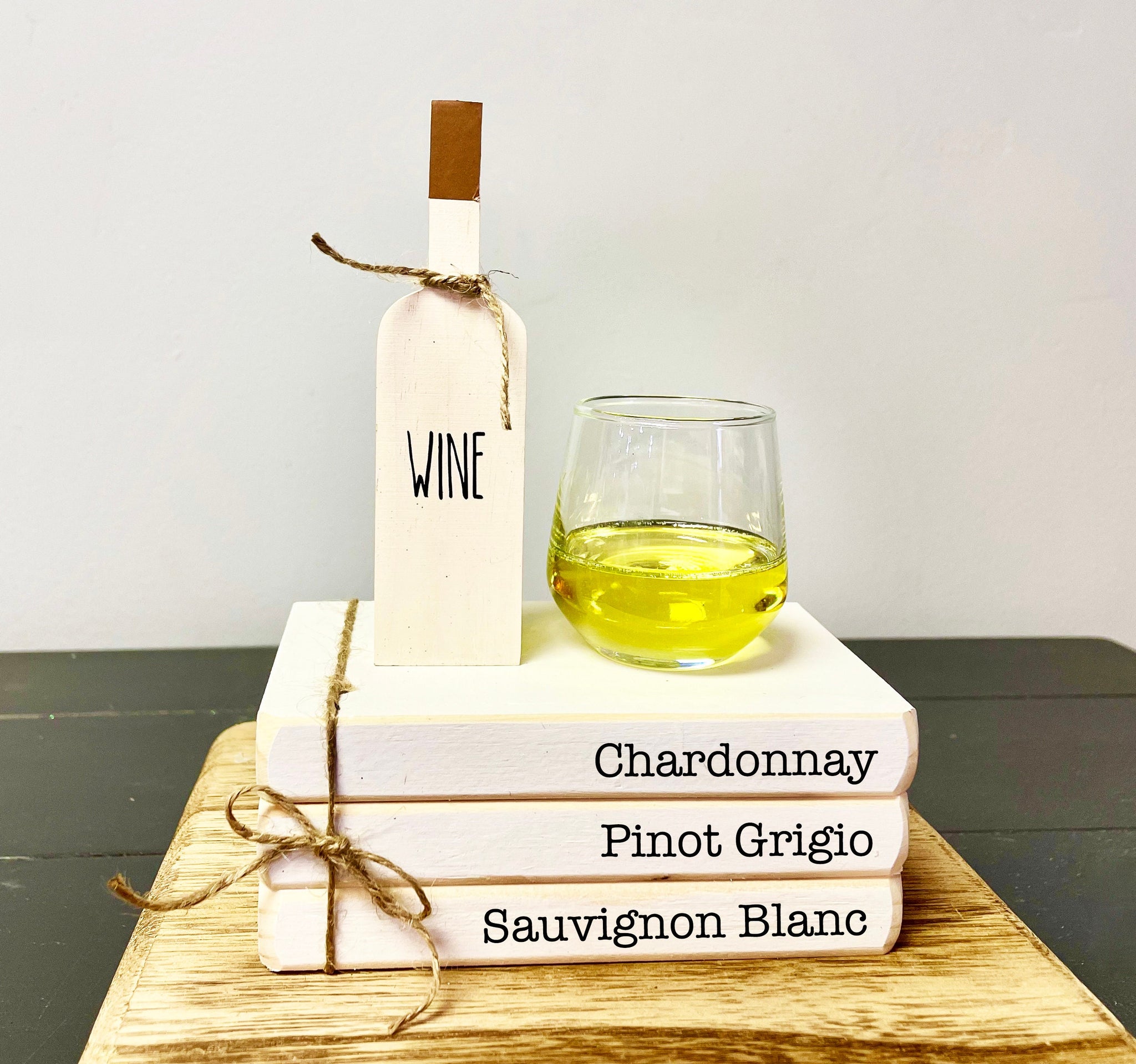Faux wine, mini wine glass, book stack, tiered tray decor, White wines