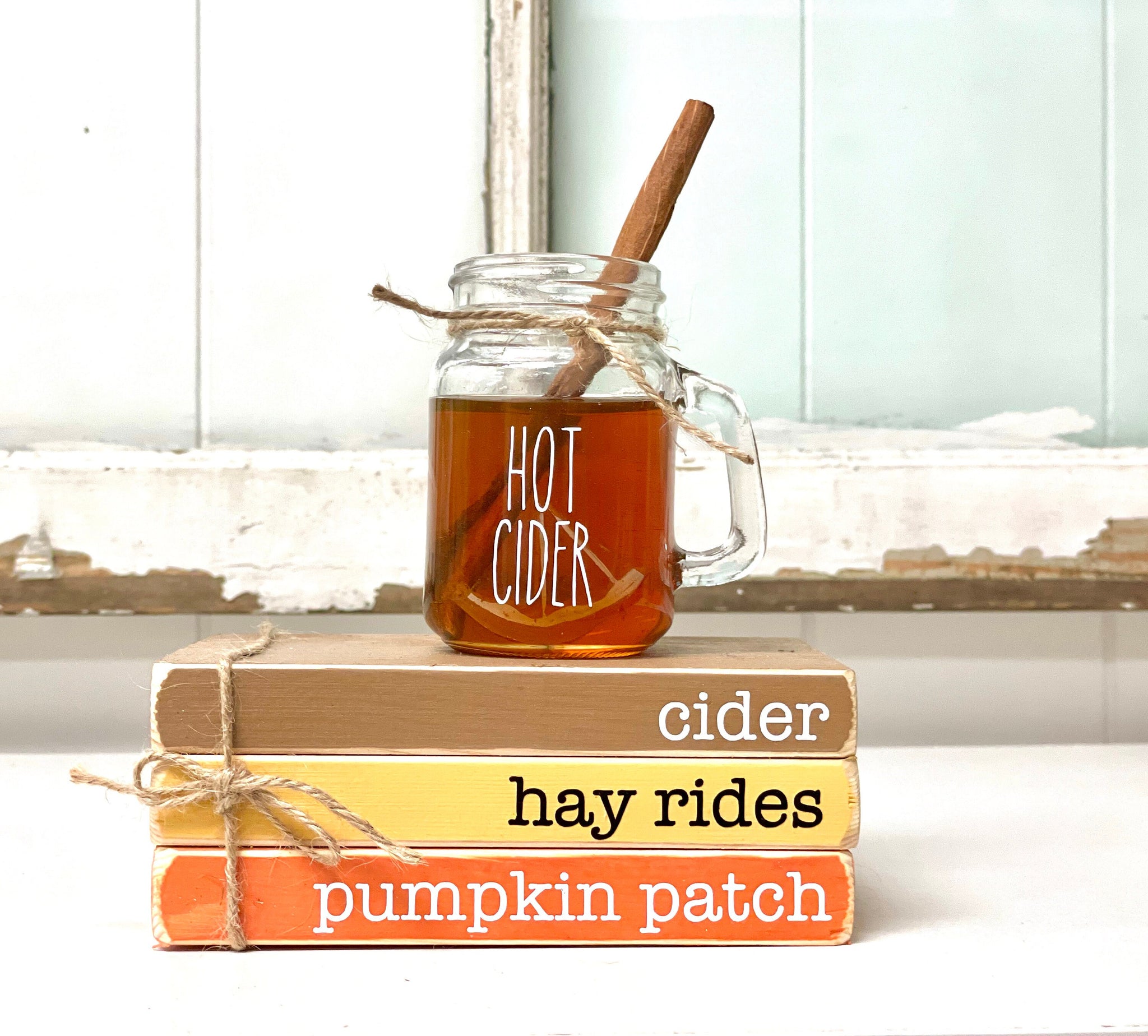 Fall books, Wooden book stack, Fall tiered tray decor, Faux hot cider mug